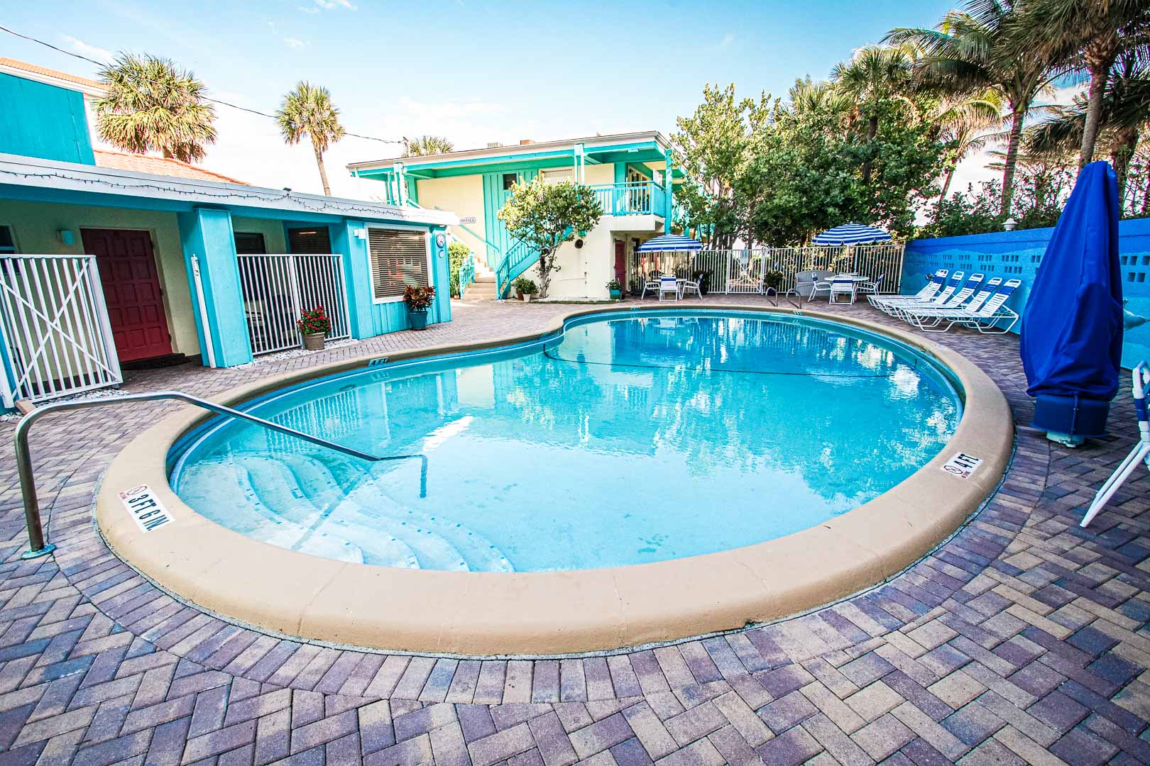 a crisp outdoor swimming pool at VRI's Sand Dune Shores in Florida.